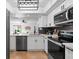 Bright kitchen features stainless steel appliances, quartz countertops, and modern black hardware at 408 S Arrawana Ave # B4, Tampa, FL 33609