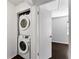 Laundry closet with stackable washer and dryer is conveniently located near bedroom at 408 S Arrawana Ave # B4, Tampa, FL 33609