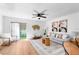 Comfortable living room with a sliding glass door, opening to outdoor space at 408 S Arrawana Ave # B4, Tampa, FL 33609