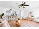 Bright, inviting living room with modern decor, sleek furniture, and an open layout to the kitchen at 408 S Arrawana Ave # B4, Tampa, FL 33609