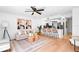 Bright living space with modern decor, wood floors, stylish furniture, and a ceiling fan at 408 S Arrawana Ave # B4, Tampa, FL 33609