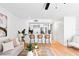 Open concept living room featuring a kitchen bar, stylish furnishings, and natural light at 408 S Arrawana Ave # B4, Tampa, FL 33609