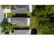Aerial view of the home, showcasing its backyard and proximity to lush trees at 4250 Warwick Hills Dr, Wesley Chapel, FL 33543