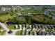 An aerial view of the community with lakes, pools, tennis courts, and well-maintained homes at 4250 Warwick Hills Dr, Wesley Chapel, FL 33543