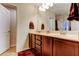 Bright bathroom featuring a double sink vanity, tile flooring, and a neutral color scheme at 4250 Warwick Hills Dr, Wesley Chapel, FL 33543