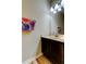 Bathroom featuring a single sink vanity, mirror, and neutral wall color at 4250 Warwick Hills Dr, Wesley Chapel, FL 33543