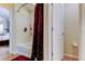 Bathroom featuring a shower with a curtain, white walls, and tile flooring at 4250 Warwick Hills Dr, Wesley Chapel, FL 33543