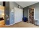 Bright bedroom featuring a closet, carpet flooring, and a charming bookshelf at 4250 Warwick Hills Dr, Wesley Chapel, FL 33543
