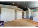 Large bonus room showcasing white closets, access to other rooms, and neutral carpet at 4250 Warwick Hills Dr, Wesley Chapel, FL 33543