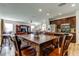 Spacious dining area adjacent to the kitchen, featuring an abundance of natural light and new wood flooring at 4250 Warwick Hills Dr, Wesley Chapel, FL 33543