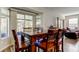 Dining room with a large table, chairs, and sliding glass doors to the backyard at 4250 Warwick Hills Dr, Wesley Chapel, FL 33543