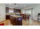 Eat-in kitchen with granite countertops, wood cabinets, and stainless steel appliances at 4250 Warwick Hills Dr, Wesley Chapel, FL 33543