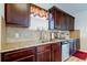 Kitchen features stainless steel appliances, granite countertops, and dark wood cabinets at 4250 Warwick Hills Dr, Wesley Chapel, FL 33543