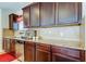 Kitchen features stainless steel appliances, light-colored countertops, and wood cabinetry at 4250 Warwick Hills Dr, Wesley Chapel, FL 33543