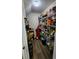 Pantry features wooden floors and wire shelving stocked full of food at 4250 Warwick Hills Dr, Wesley Chapel, FL 33543