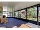 The sunroom features wicker furniture and an outdoor view at 4250 Warwick Hills Dr, Wesley Chapel, FL 33543