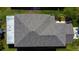 Overhead view of a well-maintained roof and partial backyard at 4250 Warwick Hills Dr, Wesley Chapel, FL 33543
