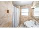 Bathroom featuring a shower with tan tile, vanity sink and updated fixtures at 4846 Highland S St, St Petersburg, FL 33705