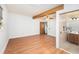 Bedroom featuring a ceiling beam, a ceiling fan, and light wood floors at 4846 Highland S St, St Petersburg, FL 33705