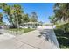 Well-kept single-story home with a long driveway and manicured lawn with a charming picket fence at 4846 Highland S St, St Petersburg, FL 33705