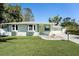 Beautifully maintained single-story home featuring a lush green lawn and inviting front entrance at 4846 Highland S St, St Petersburg, FL 33705