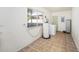 Functional laundry room with tile floors, a window, and essential appliances at 4846 Highland S St, St Petersburg, FL 33705