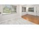 Open-concept living area featuring hardwood flooring and a view of the kitchen at 4846 Highland S St, St Petersburg, FL 33705