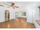 Open-concept living area with hardwood floors and plenty of natural light at 4846 Highland S St, St Petersburg, FL 33705