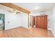 Open living room featuring wood-look flooring, a ceiling fan, and easy access to the bathroom at 4846 Highland S St, St Petersburg, FL 33705