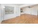 Spacious living room with abundant natural light, wood-look floors, and neutral decor at 4846 Highland S St, St Petersburg, FL 33705