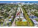 Birds eye view of townhome community with a pool, green space, and neighborhood streets at 5502 Liberty Plain Cir, Tampa, FL 33611