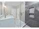 Beautiful bathroom with tile flooring, a glass-enclosed shower, and a double vanity at 5502 Liberty Plain Cir, Tampa, FL 33611