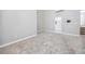 Large, carpeted bonus room with a vaulted ceiling, neutral walls, and open to the bathroom at 5502 Liberty Plain Cir, Tampa, FL 33611