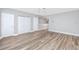 Large bedroom boasts light gray walls, wood floors, white trim, and ample natural light at 5502 Liberty Plain Cir, Tampa, FL 33611