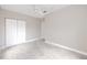 Bright bedroom boasts neutral carpet, ceiling fan, a closet and ample space at 5502 Liberty Plain Cir, Tampa, FL 33611