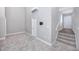 Carpeted room with a large window providing natural light, great for a bedroom or office space at 5502 Liberty Plain Cir, Tampa, FL 33611