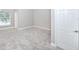 Cozy carpeted bedroom with ample light from the window at 5502 Liberty Plain Cir, Tampa, FL 33611