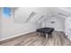 Bonus room features a pool table with a black cover and wood floors at 5502 Liberty Plain Cir, Tampa, FL 33611