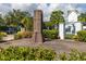 Legacy Park signage with an iron gate and pillars is landscaped with well manicured shrubs and plants at 5502 Liberty Plain Cir, Tampa, FL 33611