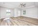 Spacious, light-filled living room features new hardwood floors, recessed lighting, and large windows at 5502 Liberty Plain Cir, Tampa, FL 33611