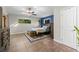 Cozy bedroom featuring a skylight, a accent wall, and stylish decor, creating a relaxing and comfortable retreat at 5803 Myrtle Ln, Tampa, FL 33625