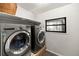 Convenient laundry room with modern appliances and a practical layout at 5803 Myrtle Ln, Tampa, FL 33625