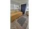 Bedroom with daybed, decorative rug, and natural light, creating a relaxing and versatile space at 585 Sky Harbor Dr # 120, Clearwater, FL 33759