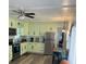 Bright eat-in kitchen with stainless steel appliances, modern cabinets, and hardwood flooring at 585 Sky Harbor Dr # 120, Clearwater, FL 33759