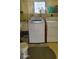 Small laundry room with a sink, washer and dryer, and a window at 585 Sky Harbor Dr # 120, Clearwater, FL 33759