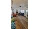 Cozy living room with hardwood floors, comfortable seating, and a ceiling fan for added comfort at 585 Sky Harbor Dr # 120, Clearwater, FL 33759