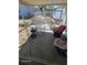 Enclosed patio with screen windows, concrete floors and patio furniture at 585 Sky Harbor Dr # 120, Clearwater, FL 33759