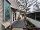 This backyard features a mosaic, awning, french doors, and leads to a landscaped outdoor space at 6166 9Th N Ave, St Petersburg, FL 33710