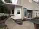 Backyard of a two story house with a sidewalk and stairs leading to the entrance at 6166 9Th N Ave, St Petersburg, FL 33710