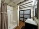 Bathroom features a dark vanity with a granite countertop and a new shower with curtain at 6166 9Th N Ave, St Petersburg, FL 33710